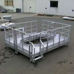 Mobile interlocking workplatforms Mobile interlocking industrial platforms on wheels for machine assembly and maintenance.